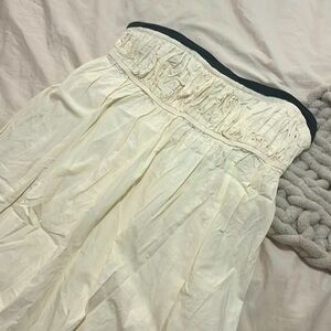 Strapless, open back, tea length dress